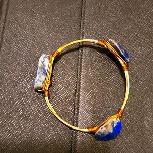 Wire wrapped bangle bracelet with three purple stones